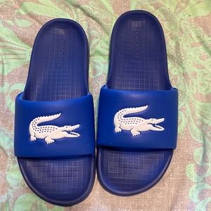 Like new Lacoste slides. Size 10 . Worn around the house to try.